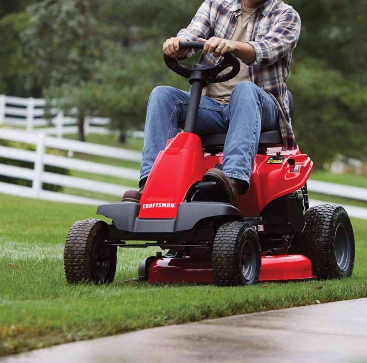 Homeowner mowing a lawn with the CRAFTSMAN R110 riding mower
