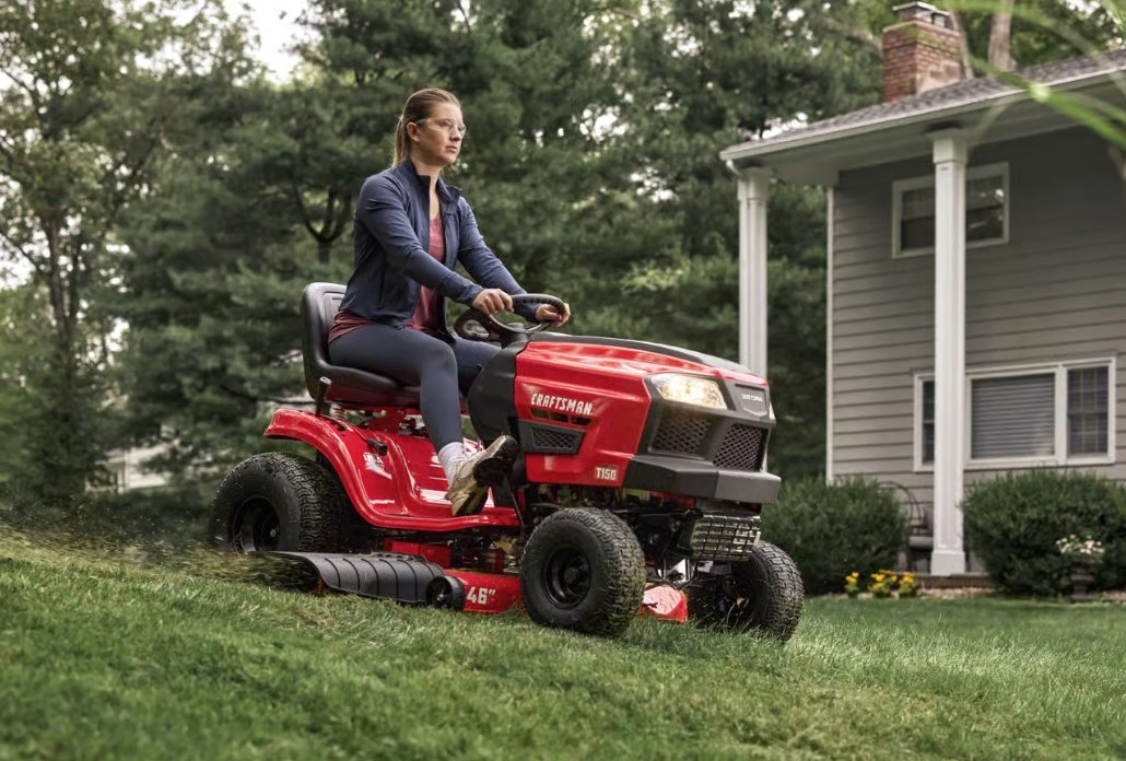 CRAFTSMAN T150 riding lawn tractor mowing around a home